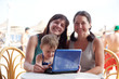 family with laptop at resort beach family with laptop at resort beach