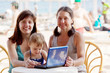 happy women with laptop at resort happy women with laptop at resort