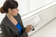 Photo: Business woman using a tablet computer Business woman using a tablet computer