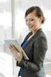 Photo: Business woman using a tablet computer Business woman using a tablet computer