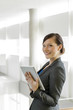 Photo: Business woman using a tablet computer Business woman using a tablet computer