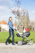woman with a pram on spring walk