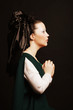 Photo: woman with long hair in historical medieval green dress woman with long hair in historical medieval green dress