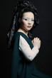 Photo: woman with long hair in historical medieval green dress woman with long hair in historical medieval green dress