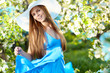 Woman wearing blue dress in amazing fruits garden