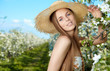 portrait of young lovely woman in spring flowers portrait of young lovely woman in spring flowers