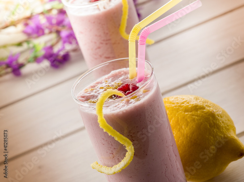 Photo: raspberry milkshake on glass with straw raspberry milkshake on glass with straw
