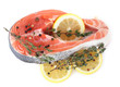 Red fish with lemon and thyme isolated on white.