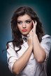 portrait of attractive  woman with blue background