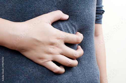 Photo: Woman Suffering From Abdominal Pain. Woman Suffering From Abdominal Pain.
