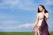 beautiful woman on green field in dress beautiful woman on green field in dress