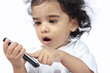 Photo: Cute Indian Baby Playing with Phone Cute Indian Baby Playing with Phone