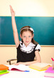 beautiful little schoolgirl in classroom