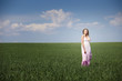 beautiful woman on green field in dress beautiful woman on green field in dress