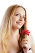Beautiful girl holding a red rose, isolated on white