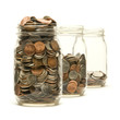 Three glass jars filled with American coins Three glass jars filled with American coins