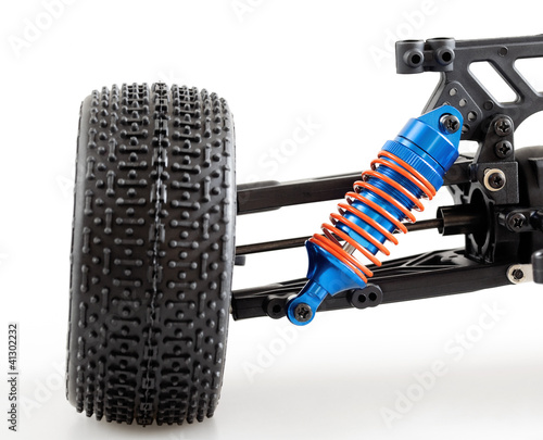 Photo: suspension of modern radio controlled car on white background suspension of modern radio controlled car on white background