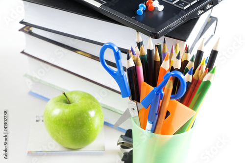 Photo: office supply and apple on white background office supply and apple on white background