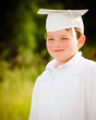 Young boy with cap and gown for preschool graduation Young boy with cap and gown for preschool graduation