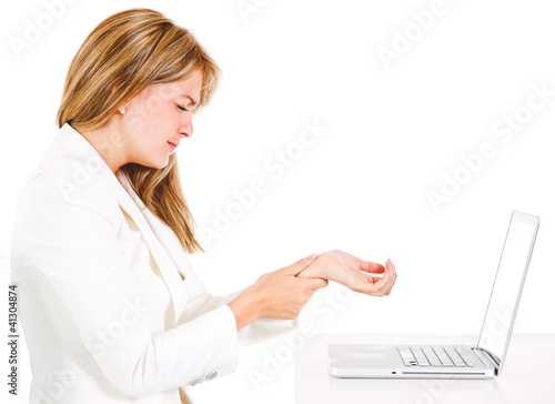 Photo: Businesswoman suffering carpal tunnel syndrome Businesswoman suffering carpal tunnel syndrome