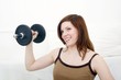 happy woman with dumbbell