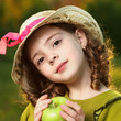 girl with fruit in park girl with fruit in park