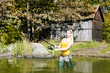 woman fishing in pond