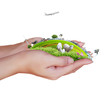 Hand holding a house ands nature