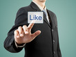 canvas print picture - businessman hand pushing Like button
