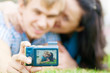 Happy teenage couple taking picture