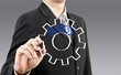 Businessman drawing gear to success Businessman drawing gear to success