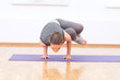 Woman doing stretching yoga exercise at sport gym Woman doing stretching yoga exercise at sport gym