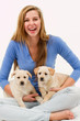 Oortrait of happy girl with cute puppies