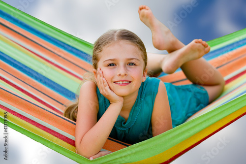 Photo: Lovely girl in colorful hammock Lovely girl in colorful hammock