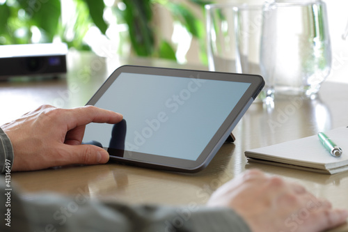Photo: Touching screen of a digital tablet Touching screen of a digital tablet