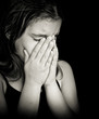 Black and white portrait of a girl crying