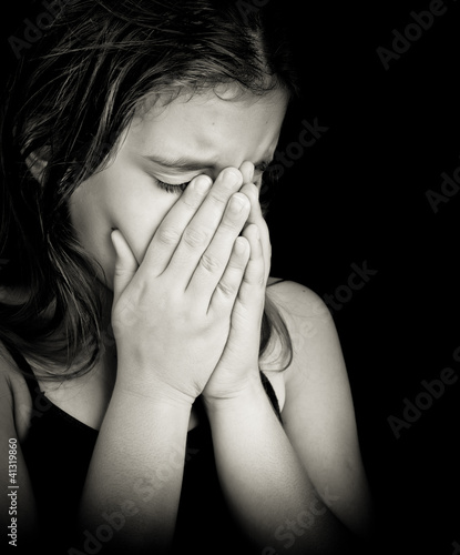 Photo: Black and white portrait of a girl crying Black and white portrait of a girl crying