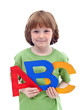 Little school boy with large letters