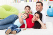 Happy family together on the floor