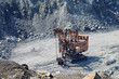 Old rusty excavator in the asbestos quarry