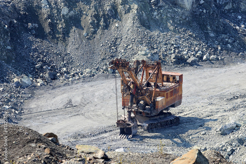 Photo: Old rusty excavator in the asbestos quarry Old rusty excavator in the asbestos quarry