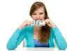 Woman biting dollar bill