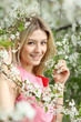 Portrait of beautiful blond in spring blossom Portrait of beautiful blond in spring blossom
