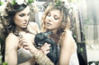 Two romantic beauty ladies in garden Two romantic beauty ladies in garden