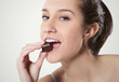 Photo: woman eating chocolate woman eating chocolate