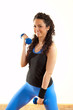 Pretty fitness girl with weights