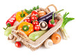 fresh vegetables with leaves in the basket isolated on white
