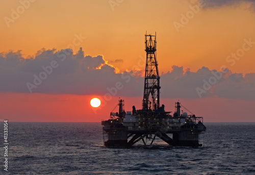 Photo: Drilling rig in sunset Drilling rig in sunset