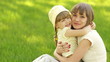 Mother and daughter playing in the meadow