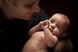 canvas print picture - Young Father Holding His Mixed Race Newborn Baby
